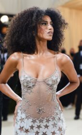 Imaan Hammam Full Glam in a Sheer Versace Gown at The 2021 Met Gala