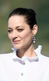 Marion Cotillard Attended The Donostia Award Photocall In A Sheer White Blouse And Pink Jeans At The Kursaal Centre
