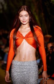 Dazzling Gigi Hadid in an Orange Crop Top at Coperni Event for 2021 Paris Fashion Week