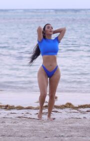 Kim Kardashian in Bright Blue Swimsuit for SKIMS Swimwear Photoshoot