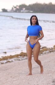 Kim Kardashian in Bright Blue Swimsuit for SKIMS Swimwear Photoshoot