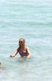 Amazing Kimberley Garner in a Tiny Purple Bikini at Miami Beach - April 27, 2022