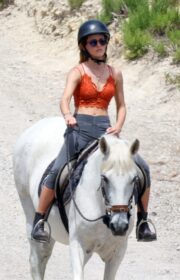 Emma Watson in Orange Bralette Enjoys Horseback Riding in Ibiza 2022