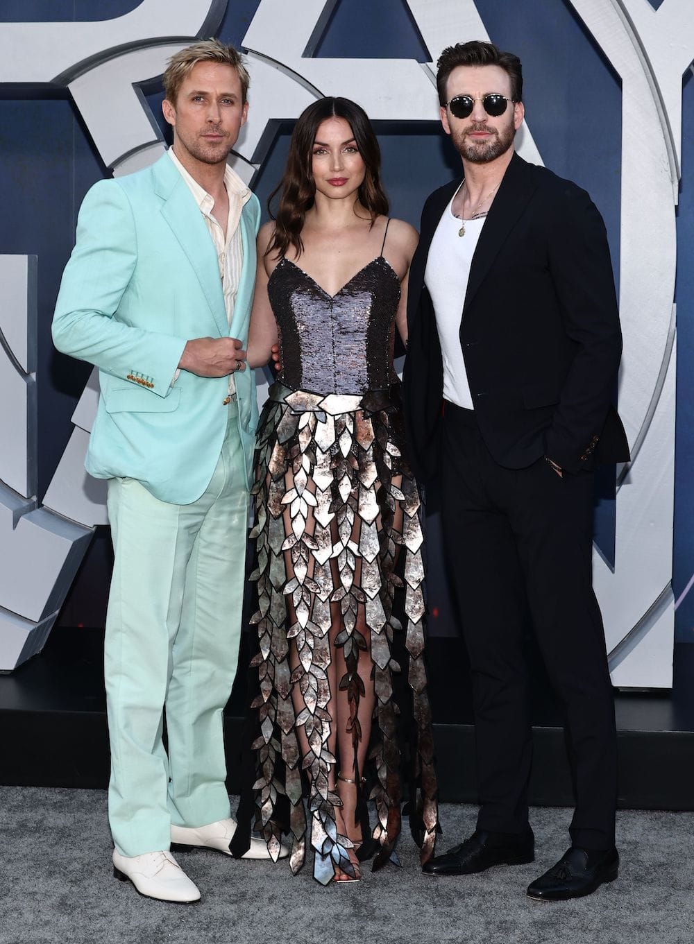 Ana de Armas with her co-stars Ryan Gosling and Chris Evans at The Gray Man Los Angeles Premiere on July 13, 2022.