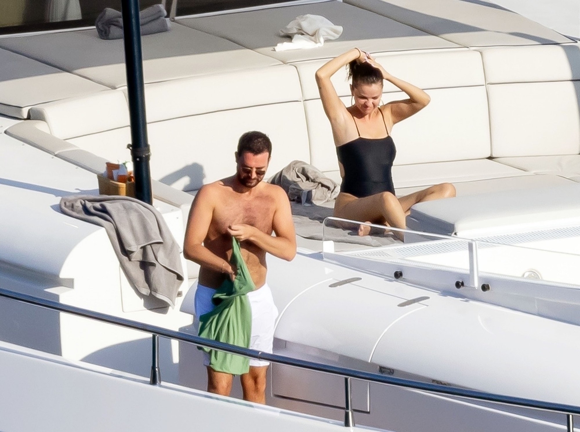 Selena Gomez sunbathing with her rumoured boyfriend Andrea Iervolino on a yacht.