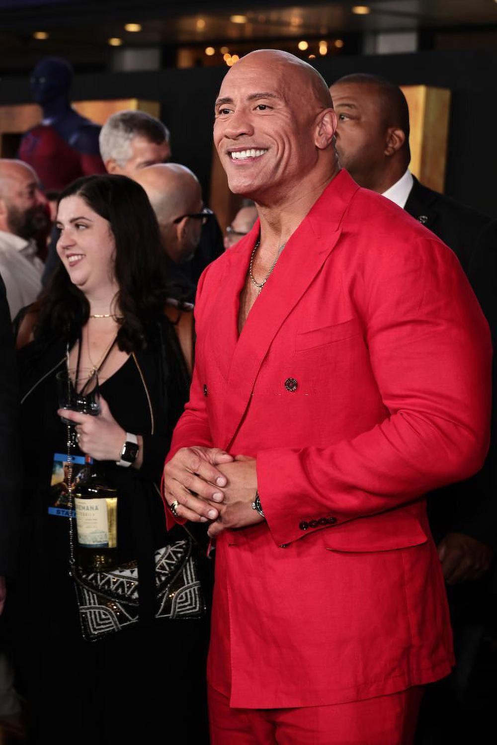 Dwayne, who plays the role of Black Adam in a red D&G suit.